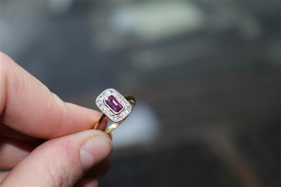 A 1920s/1930s 18ct gold and platinum ruby and diamond tablet ring, size M.